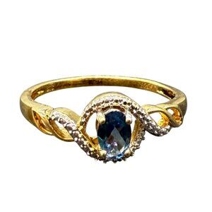 Gold-Plated Sterling Silver Ring With Oval Blue Topaz & Shiny Accents
